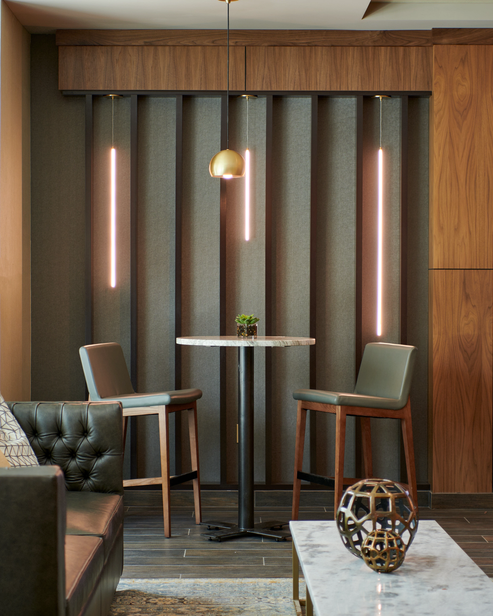 High-top table and chairs in a lounge seating area at Life Time